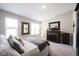 Comfortable bedroom features a fireplace, soft carpet, and a well-lit interior at 8194 Bostic Ct, Fishers, IN 46038