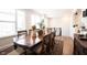Bright dining room featuring a wooden table, large windows, and a decorative area rug at 8194 Bostic Ct, Fishers, IN 46038