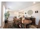 Elegant dining room with hardwood floors, a large table, and stylish décor at 8194 Bostic Ct, Fishers, IN 46038