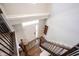 Bright entryway featuring hardwood stairs and floors, a decorative rug, and ample natural light at 8194 Bostic Ct, Fishers, IN 46038