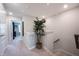 Upstairs hallway with neutral walls, a decorative potted tree, and access to rooms at 8194 Bostic Ct, Fishers, IN 46038