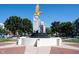 Striking statue of an eagle atop a monument in Liberty Plaza, surrounded by lush greenery and trees at 8194 Bostic Ct, Fishers, IN 46038