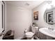 Stylish powder room featuring modern fixtures, a decorative mirror, and a clean, minimalist design at 8194 Bostic Ct, Fishers, IN 46038