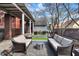 Outdoor patio featuring comfortable seating, a pergola, manicured landscaping, and a tranquil atmosphere at 827 N Park Ave, Indianapolis, IN 46202