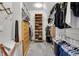 Well-organized closet with shelves, hanging rods, and a dresser for optimal storage at 827 N Park Ave, Indianapolis, IN 46202