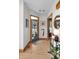 Inviting entryway with hardwood floors, stylish decor, and a decorative stained glass front door at 827 N Park Ave, Indianapolis, IN 46202