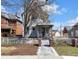 Well-maintained home featuring a fenced yard and a quaint walkway at 827 N Park Ave, Indianapolis, IN 46202