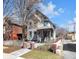 Charming two-story home with a fenced yard and inviting front porch at 827 N Park Ave, Indianapolis, IN 46202