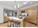 Bright kitchen with stainless appliances, central island, and hardwood floors at 827 N Park Ave, Indianapolis, IN 46202