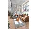 Comfortable living room with modern furnishings, bright light, and a stylish area rug at 827 N Park Ave, Indianapolis, IN 46202