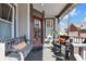 Comfortable porch with swing and seating; an inviting entry at 827 N Park Ave, Indianapolis, IN 46202