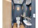 Stylish powder room with elegant fixtures, charming accents, and a modern sink at 827 N Park Ave, Indianapolis, IN 46202