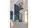 Bedroom view of modern spiral staircase and accent wall at 827 N Park Ave, Indianapolis, IN 46202