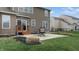 Well-maintained backyard with a patio, lawn, and mature landscaping at 8536 Blue Marlin Dr, Indianapolis, IN 46239