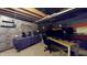 Partially finished basement featuring office space and brick accent wall at 8536 Blue Marlin Dr, Indianapolis, IN 46239