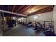Unfinished basement area with gym equipment and ample space for storage at 8536 Blue Marlin Dr, Indianapolis, IN 46239