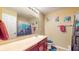 Bright bathroom features a large mirror, colorful artwork and a shower-tub for a functional space at 8536 Blue Marlin Dr, Indianapolis, IN 46239