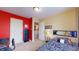 Vibrant bedroom features unique accent walls, closet space, and cozy sleeping arrangement at 8536 Blue Marlin Dr, Indianapolis, IN 46239
