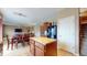 Bright open concept kitchen with island, black appliances and access to dining and living room at 8536 Blue Marlin Dr, Indianapolis, IN 46239