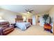 Large primary bedroom with neutral tones, sitting area, and ample natural light at 8536 Blue Marlin Dr, Indianapolis, IN 46239