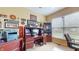 Functional office space with a desk, built-in storage, and natural light from a window at 8536 Blue Marlin Dr, Indianapolis, IN 46239
