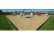 Community playground with swings, slides, and ample space for to run around at 8536 Blue Marlin Dr, Indianapolis, IN 46239