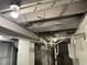 Exposed basement ceiling showing duct work and utilities at 937 N Bosart Ave, Indianapolis, IN 46201