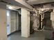 Unfinished basement area with utility connections and exposed ceiling at 937 N Bosart Ave, Indianapolis, IN 46201