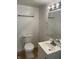 Bathroom featuring a toilet, and vanity with mirror at 937 N Bosart Ave, Indianapolis, IN 46201