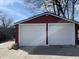 Two-car garage with new white doors and updated siding at 937 N Bosart Ave, Indianapolis, IN 46201
