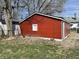 Detached red one-car garage with a white window and siding at 937 N Bosart Ave, Indianapolis, IN 46201