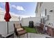 A fenced backyard features outdoor seating, a barbecue grill, and faux turf at 9694 Angelica Dr, Noblesville, IN 46060