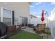 A fenced backyard features outdoor seating and a sliding glass door at 9694 Angelica Dr, Noblesville, IN 46060