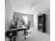 Carpeted bedroom featuring a ceiling fan, desk, chair, and a bookcase at 9694 Angelica Dr, Noblesville, IN 46060