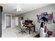 Carpeted bedroom featuring a ceiling fan, desk, chair, and exercise equipment at 9694 Angelica Dr, Noblesville, IN 46060