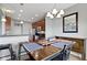 Elegant dining area with a wooden table, stylish chairs, and ample natural light, ideal for Gathering meals and gatherings at 9694 Angelica Dr, Noblesville, IN 46060