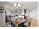 The dining room features modern furnishings and seamlessly opens to the living room and kitchen at 9694 Angelica Dr, Noblesville, IN 46060