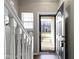 A view of the doorway with wood floors and white railing at 9694 Angelica Dr, Noblesville, IN 46060