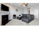Cozy living room featuring a fireplace, television, and comfortable seating, creating a welcoming atmosphere at 9694 Angelica Dr, Noblesville, IN 46060