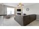 Inviting living room with a large sectional sofa, fireplace, and ample natural light, perfect for relaxation and entertaining at 9694 Angelica Dr, Noblesville, IN 46060