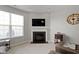 Stylish living room featuring a cozy fireplace, television, and comfortable seating, ideal for relaxation and entertainment at 9694 Angelica Dr, Noblesville, IN 46060