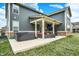 Relaxing backyard featuring a hot tub, covered patio, and comfortable outdoor seating at 10237 Sand Run Ln, Fortville, IN 46040