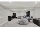Spacious basement with neutral carpet, modern furniture, and ample room for recreation and relaxation at 10237 Sand Run Ln, Fortville, IN 46040
