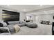 Large basement features neutral carpet, comfortable seating, a dining area, and modern decor at 10237 Sand Run Ln, Fortville, IN 46040