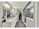 Double vanity in bathroom features a walk in shower, and entry to walk-in closet at 10237 Sand Run Ln, Fortville, IN 46040
