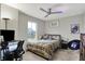 Inviting bedroom with a stylish ceiling fan, playful decor, and a cozy atmosphere at 10237 Sand Run Ln, Fortville, IN 46040