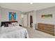 Well-lit bedroom featuring modern decor, plush bedding, and easy access to an en-suite bathroom at 10237 Sand Run Ln, Fortville, IN 46040