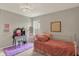 Charming bedroom with a vanity table, plush bedding, and thoughtful decor elements at 10237 Sand Run Ln, Fortville, IN 46040