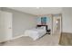 Minimalist bedroom with a comfortable bed, sleek decor, and bright natural light at 10237 Sand Run Ln, Fortville, IN 46040