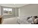 Sunlit bedroom offering generous space, plush carpeting, and a large window with scenic views at 10237 Sand Run Ln, Fortville, IN 46040